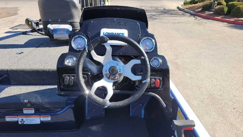 Slide: The Image of Steering console of a 2025 Nitro Z17 boat with modern controls and Lowrance display. - 8