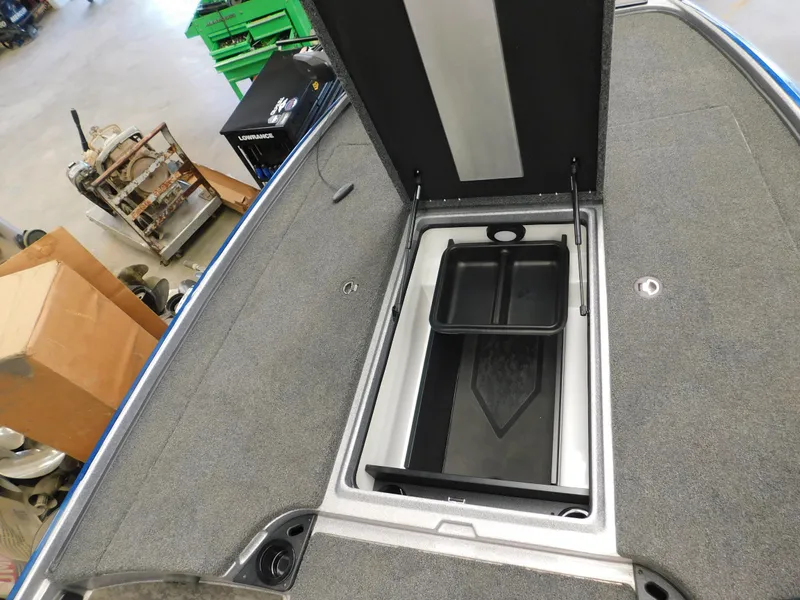 Slide: The Image of Open storage compartment on 2025 Nitro Z20 XL Pro boat, featuring organized interior space. - 11