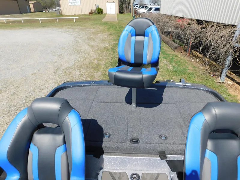 Slide: The Image of 2025 Nitro Z20 XL Pro boat with blue and gray seating on a sunny day. - 4