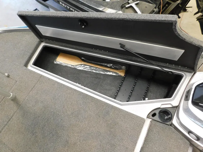 Slide: The Image of Open storage compartment in 2025 Nitro Z20 XL Pro boat. - 9