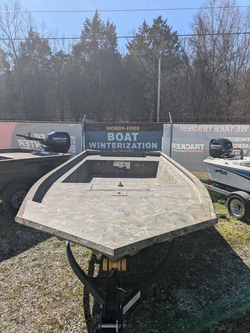 The Image of 2025 Tracker Grizzly 1754 Jon boat displayed outdoors, ready for winterization. - 0