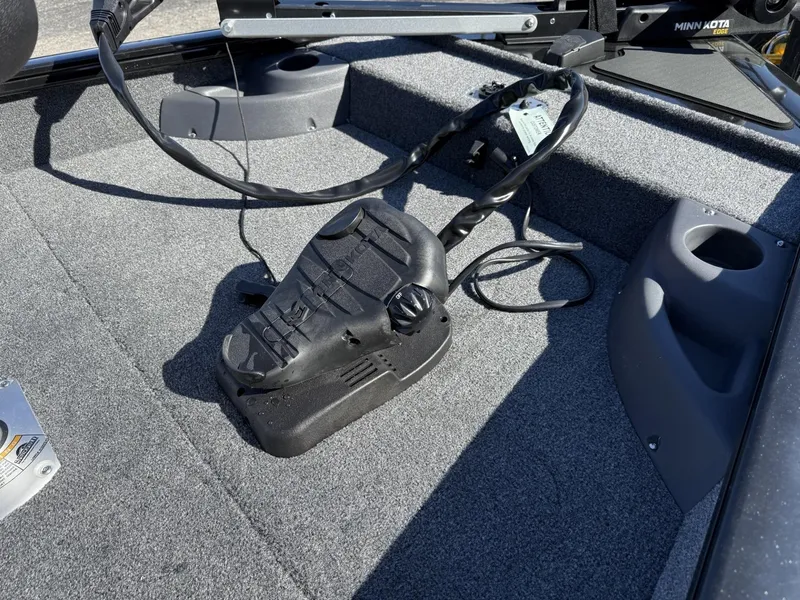 Slide: The Image of 2025 Tracker Pro Team 175 Crappie Edition boat deck with trolling motor pedal. - 10