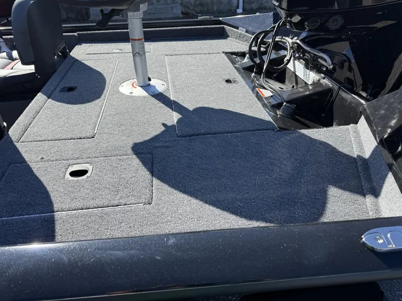 Slide: The Image of 2025 Tracker Pro Team 175 Crappie Edition boat interior with carpeted deck and seating. - 3