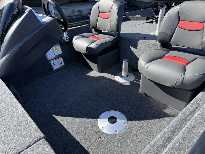 Slide: The Image of 2025 Tracker Pro Team 175 Crappie Edition boat interior with two cushioned seats. - 5