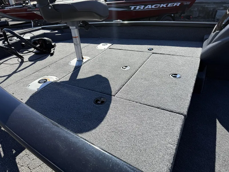 Slide: The Image of 2025 Tracker Pro Team 175 Crappie Edition boat deck with seating and storage compartments. - 6