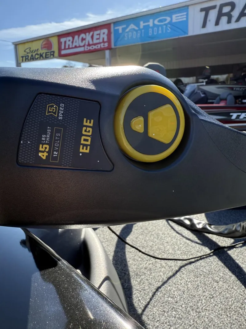 Slide: The Image of Close-up of a 2025 Tracker Pro Team 175 Crappie Edition boat control panel. - 9