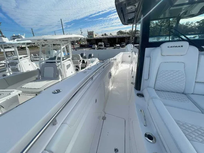Slide: The Image of 2024 Caymas 401 CC boat interior with luxurious seating and sleek design. - 13