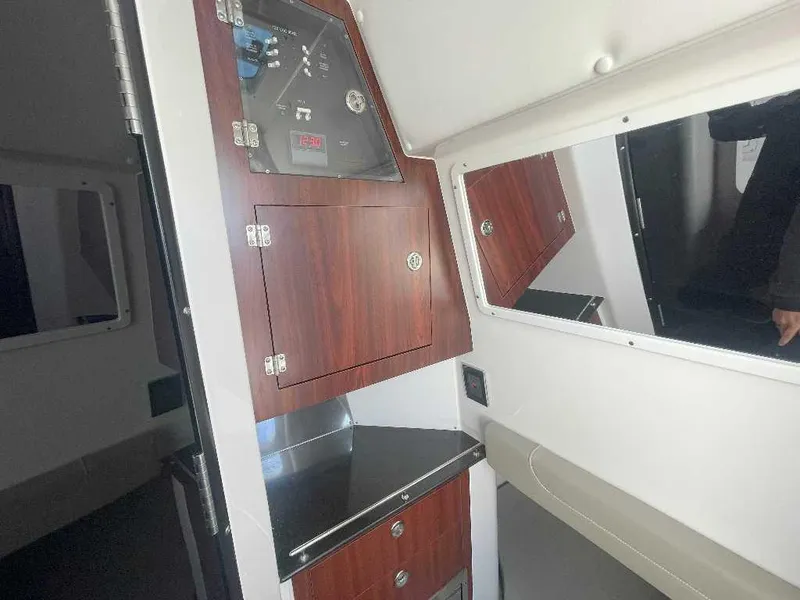 Slide: The Image of Interior of 2024 Caymas 401 CC boat with wood cabinetry and modern design. - 16