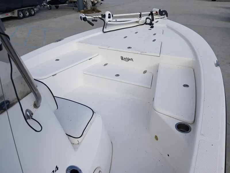 Slide: The Image of 2005 BlackJack 224 boat deck with seating and storage compartments. - 5