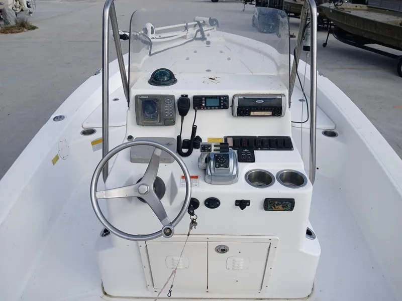 Slide: The Image of 2005 BlackJack 224 boat console with steering wheel and navigation equipment. - 7