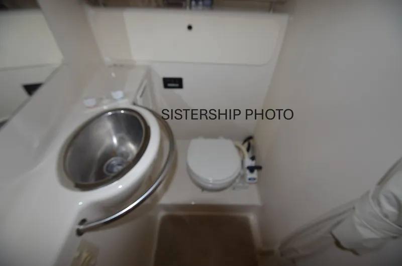 Slide: The Image of 1999 Maxum 3300 SCR boat bathroom with sink and toilet. - 10