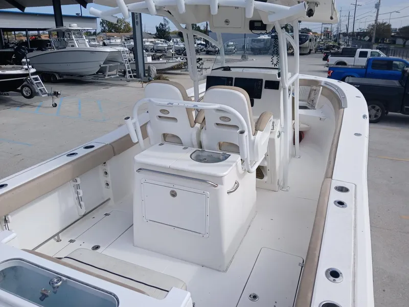 Slide: The Image of 2015 Sea Fox 286 Commander boat interior with dual seats and center console. - 10