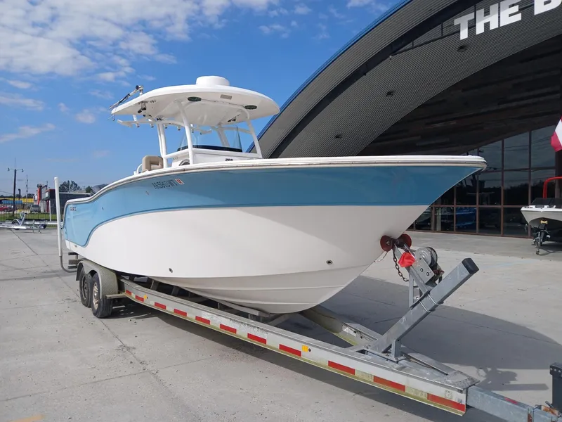 Slide: The Image of 2015 Sea Fox 286 Commander boat on trailer, parked outside a building. - 11