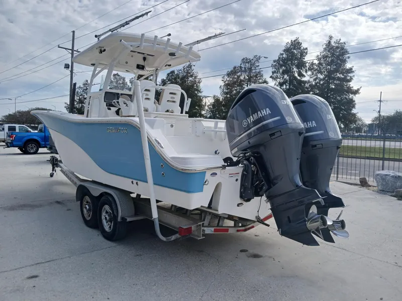 Slide: The Image of 2015 Sea Fox 286 Commander boat with twin Yamaha engines on a trailer. - 13