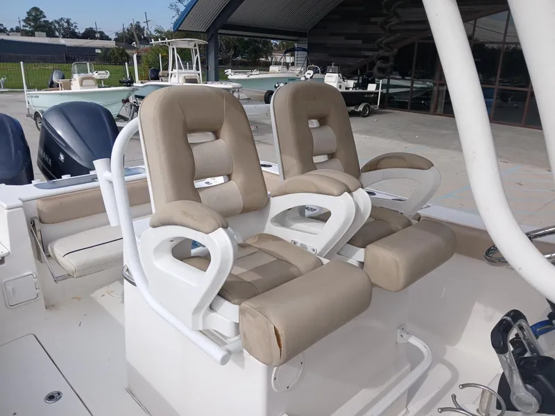 Slide: The Image of 2015 Sea Fox 286 Commander boat seats, beige upholstery, docked in marina. - 6