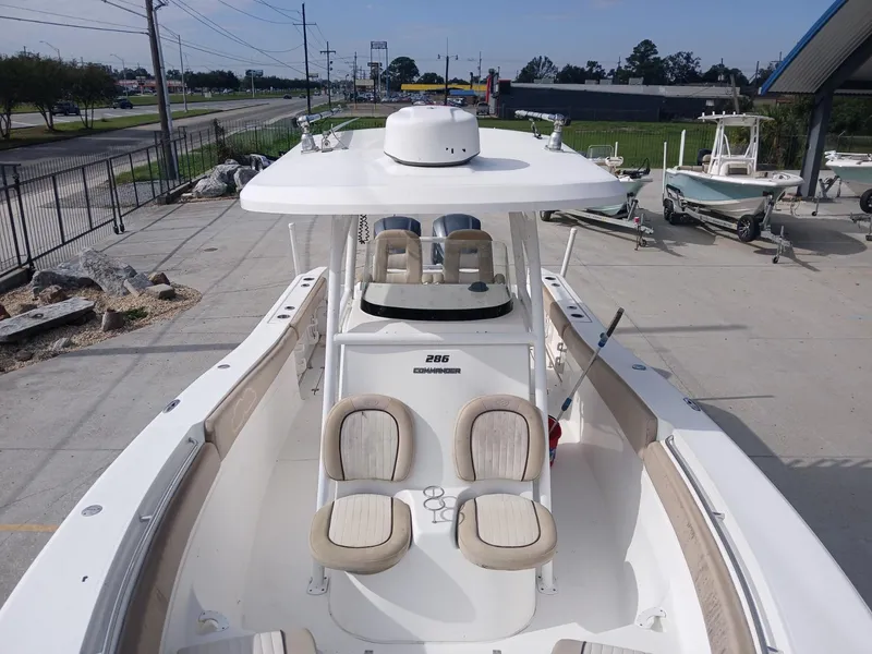 Slide: The Image of 2015 Sea Fox 286 Commander boat with dual seating, docked outdoors. - 7