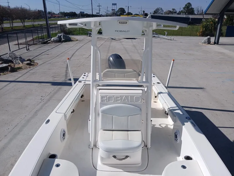 Slide: The Image of 2018 Robalo 226 Cayman boat, white interior, center console, outdoor setting. - 9