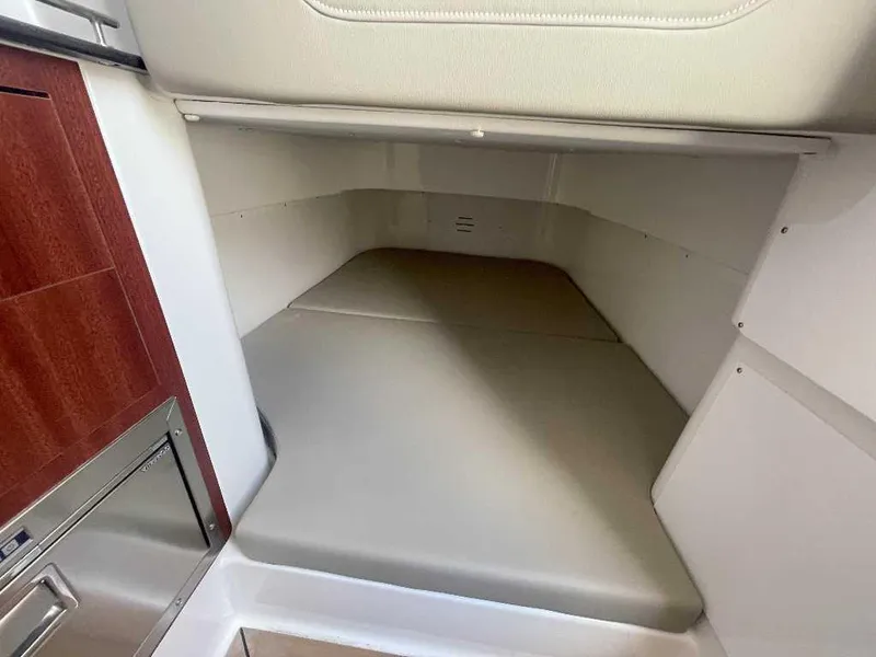 Slide: The Image of 2024 Caymas 401 CC interior cabin with cushioned seating and wooden cabinetry. - 15