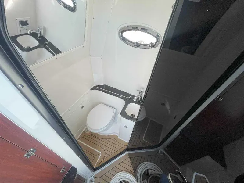 Slide: The Image of 2024 Caymas 401 CC boat bathroom with modern fixtures and wooden flooring. - 17