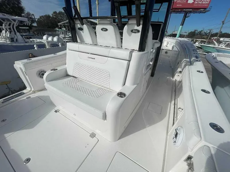 Slide: The Image of 2024 Caymas 401 CC boat interior with white seating and sleek design. - 20