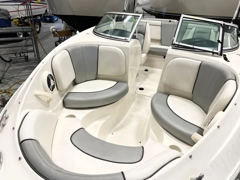 Slide: The Image of 2009 Sea Ray 185 Sport boat interior with white and gray seating. - 6