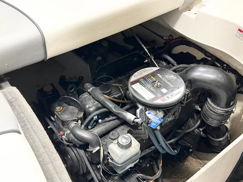 Slide: The Image of 2009 Sea Ray 185 Sport engine compartment, showcasing detailed mechanical components. - 7