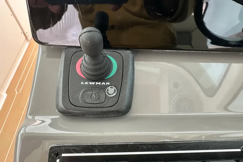 Slide: The Image of Lewmar joystick control on 2019 Pursuit DC 325 Dual Console boat dashboard. - 22