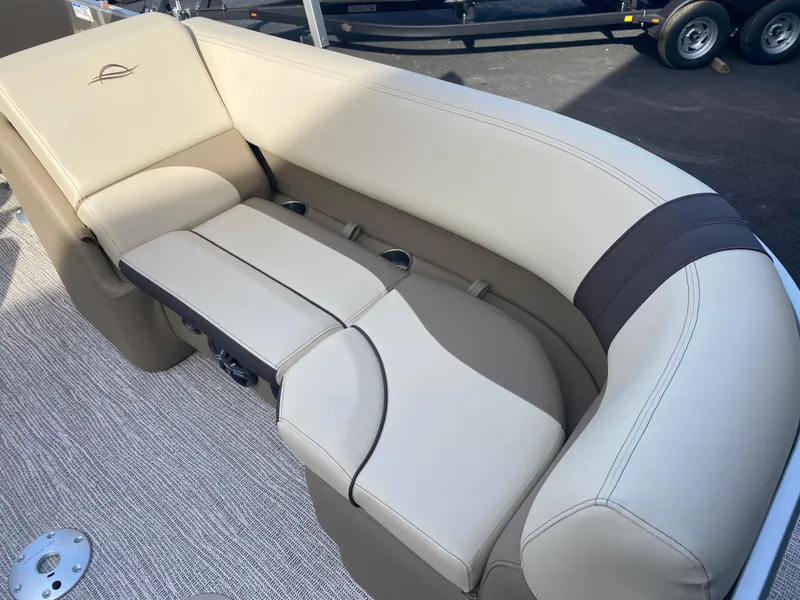 Slide: The Image of 2025 SunCatcher Select 322RC boat seating with beige and brown upholstery. - 11