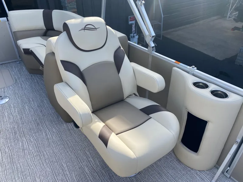 Slide: The Image of Luxurious seating on 2025 SunCatcher Select 322RC pontoon boat with cup holders. - 17