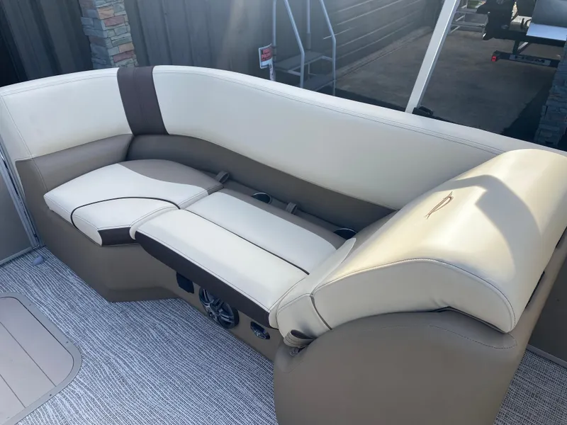 Slide: The Image of Luxurious seating on 2025 SunCatcher Select 322RC boat, featuring beige and brown upholstery. - 20