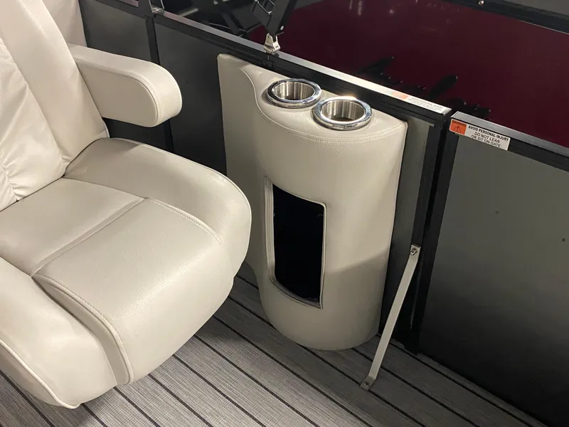 Slide: The Image of Luxury seating and cup holders in 2025 SunCatcher Select 322RC boat interior. - 24