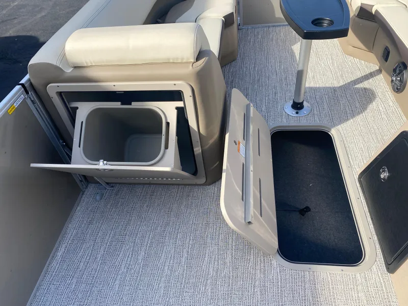 Slide: The Image of 2025 SunCatcher Select 322RC interior with storage compartments and seating. - 25