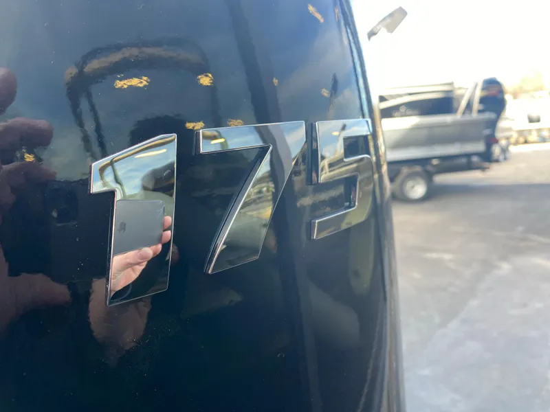 Slide: The Image of Close-up of '175' emblem on 2025 SunCatcher Select 322RC boat. - 7