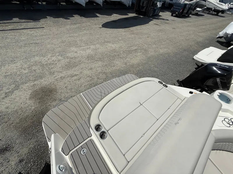 Slide: The Image of 2022 Sea Ray SLX 280 boat with spacious deck and seating area. - 14
