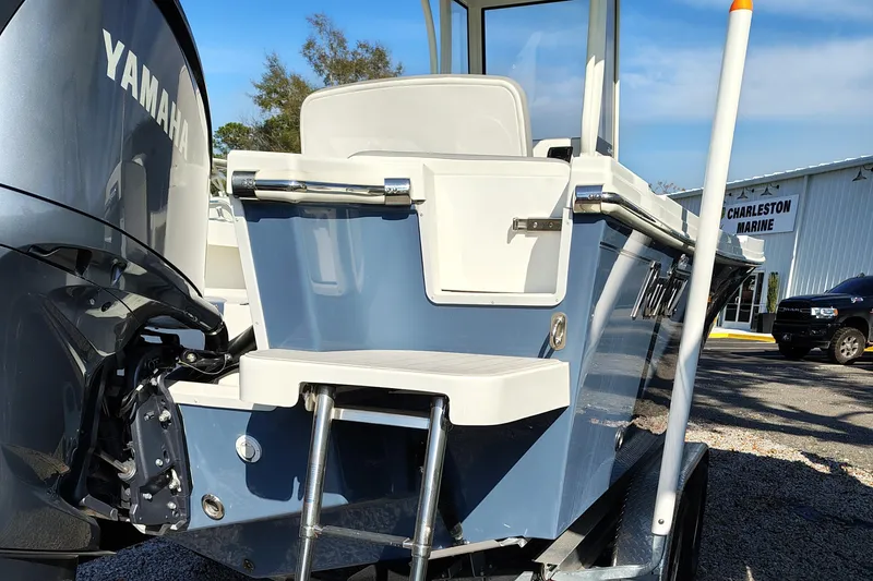 Slide: The Image of 2024 Parker 2400 Center Console boat with Yamaha engine, rear view. - 16