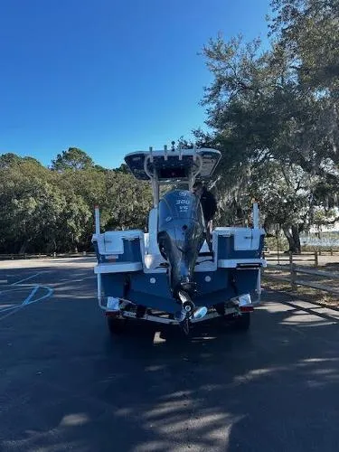 Slide: The Image of 2024 Parker 2400 Center Console boat parked outdoors, rear view. - 3