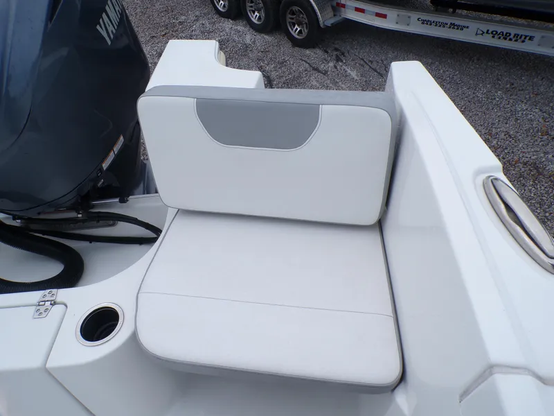 Slide: The Image of 2024 Parker 2400 Center Console boat seat with cup holder and engine view. - 5