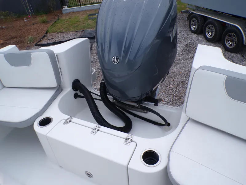 Slide: The Image of 2024 Parker 2400 Center Console boat with outboard motor and seating area. - 6