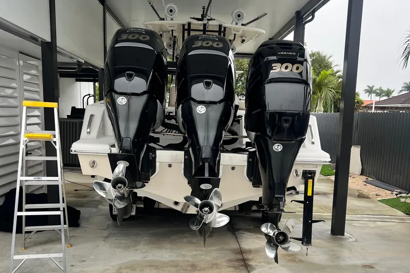 Slide: The Image of 2011 Blackwater 36 Sportfish with triple 300 horsepower engines in a covered dock. - 3