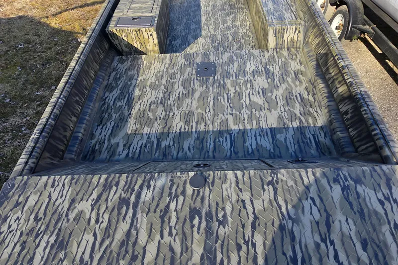 Slide: The Image of 2025 SeaArk DXS 1860 SLD boat with camouflage interior design. - 1