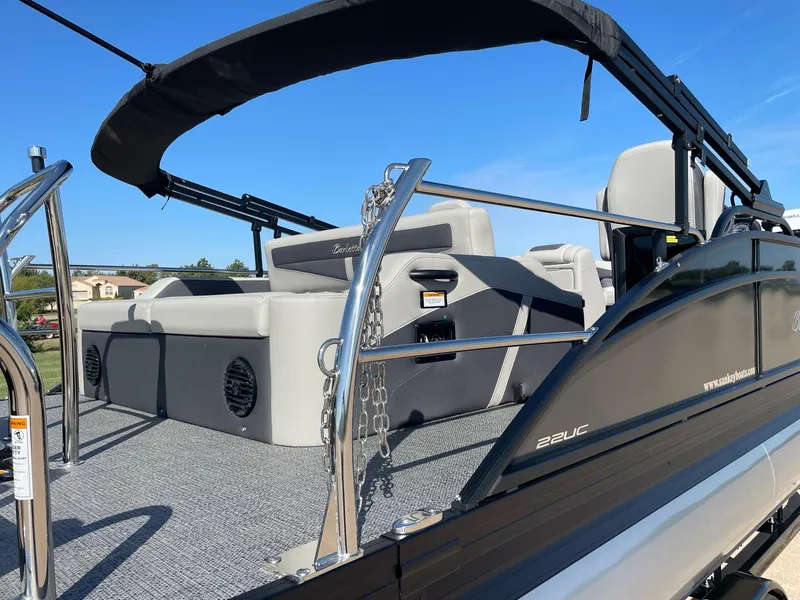 Slide: The Image of 2024 Barletta Cabrio 22UC pontoon boat with sleek design and spacious seating. - 11