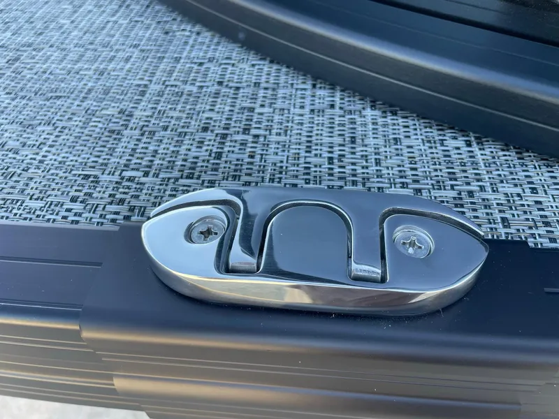 Slide: The Image of 2024 Barletta Cabrio 22UC boat cleat on textured deck surface. - 20