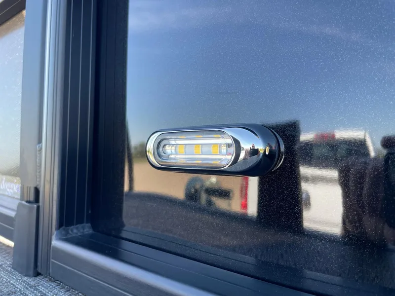 Slide: The Image of Close-up of 2024 Barletta Cabrio 22UC LED light on sleek black surface. - 21