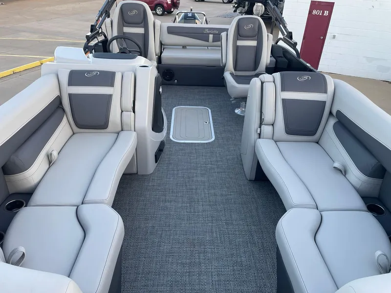 Slide: The Image of 2024 Barletta Cabrio 22UC pontoon boat interior with plush seating and modern design. - 23