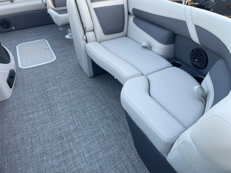 Slide: The Image of 2024 Barletta Cabrio 22UC interior with gray seating and carpet flooring. - 24