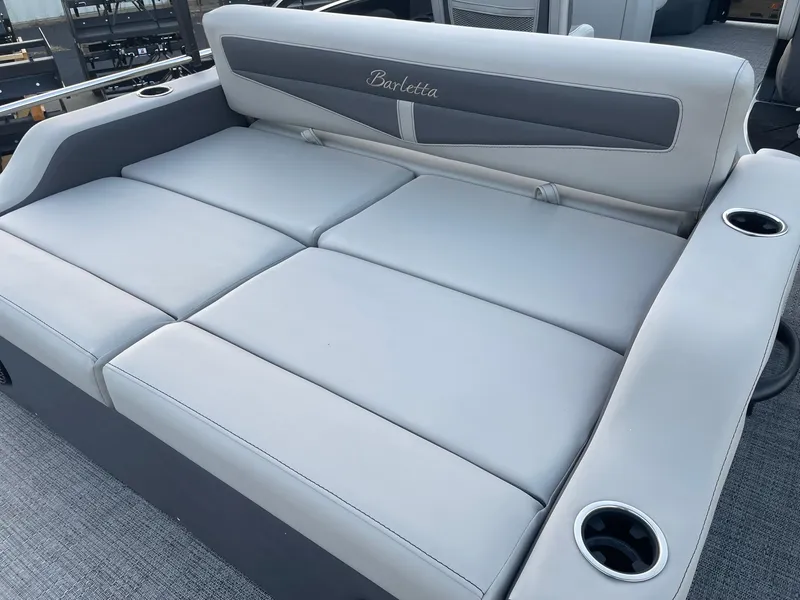 Slide: The Image of 2024 Barletta Cabrio 22UC boat seating with cup holders, featuring sleek gray upholstery. - 31