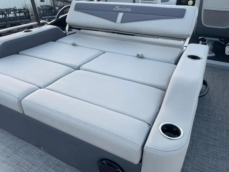 Slide: The Image of 2024 Barletta Cabrio 22UC boat seating with cup holders and gray upholstery. - 32