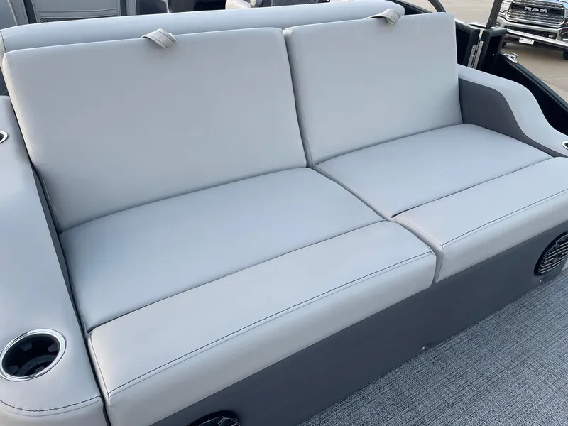 Slide: The Image of 2024 Barletta Cabrio 22UC boat seating with gray upholstery and cup holders. - 33