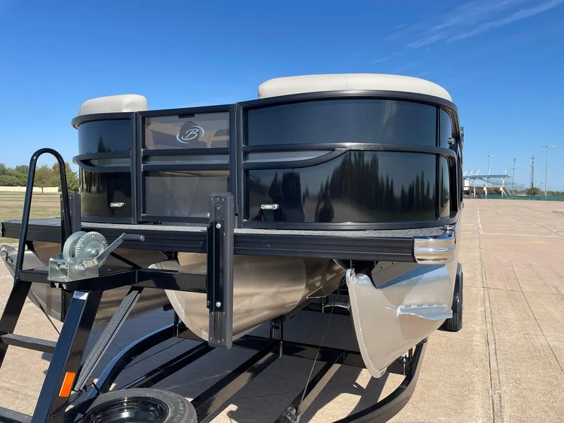 Slide: The Image of 2024 Barletta Cabrio 22UC pontoon boat on trailer, sunny day. - 5