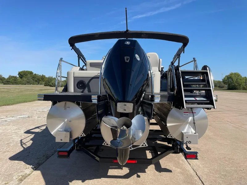 Slide: The Image of 2024 Barletta Cabrio 22UC pontoon boat, rear view with motor and propeller. - 8